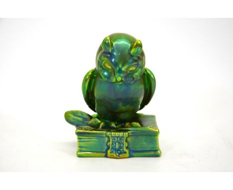 A Zsolnay Art Deco eosin owl on a book figurine, green and yellow iridescent glaze, circa 1960, 16cm high