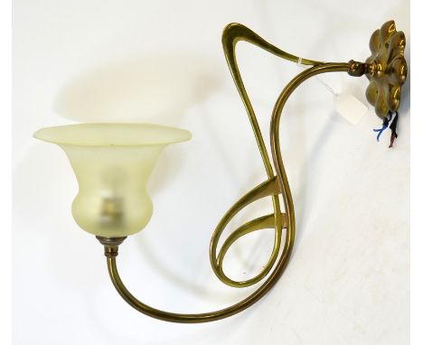 A pair of Arts and Crafts brass and glass wall lights, the angular open tendril design arms supporting bell shaped frosted st