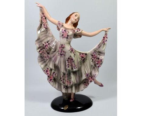 A large Goldscheider figure of a female dancer, designed by Claire Herczeg. Model 8399 72 31. Circa 1930. Impressed and print