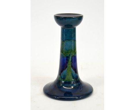William Moorcroft, a Moonlit Blue candlestick, circa 1924, splayed form, underglaze teal monogram, impressed marks, 16.5cm hi