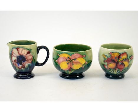 A group of three Moorcroft pieces, a clematis vase, a clematis bowl and an anemone jug, signed, impressed marks, tallest 8cm 