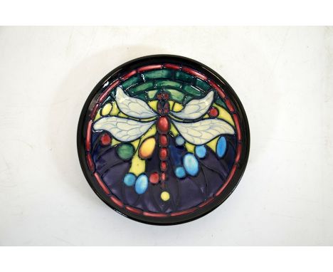 A Moorcroft Favrile pin tray, with a dragonfly in the Tiffany style, signed, impressed marks,diameter 11.5cm (boxed)