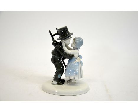 A German porcelain figure group of a chimney sweep, early 20th century, marked, 17cm high