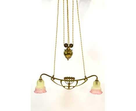 An Arts and Crafts adjustable double pendant light fitting, circa 1900, the arm with central pierced stylised bud design, sup