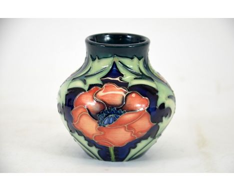 A Moorcroft trial 1996 vase, with poppies and foliage decoration on blue ground, signed, impressed marks, height 8.5cm