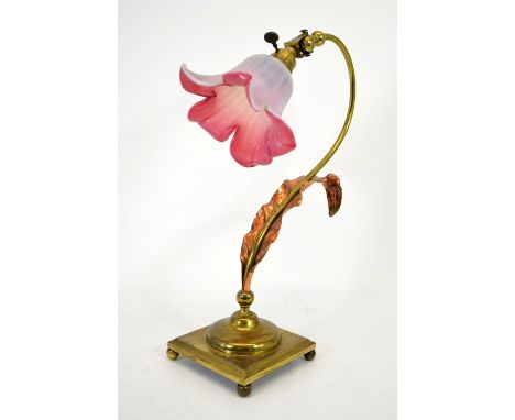 An Arts and Crafts brass and copper table lamp, in the style of W A S Benson, on square base, with copper leaf, pink opalesce