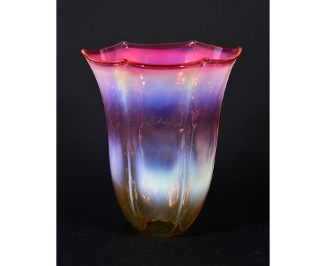 An Arts and Crafts straw cranberry opal glass light shade, martele finish with six ribbed lines and rinched rim, 13.5cm high,