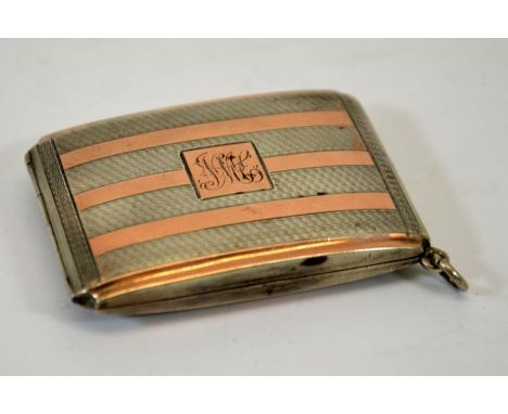 A George V silver and gold matchbook case, engine turned and stripe design, gilt interior, James Deakin and Son, Chester 1925