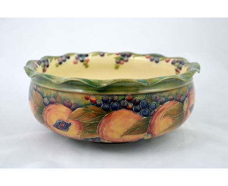 William Moorcroft, a Pomegranate bowl, flared crimped form, circa 1910, signed, 26cm diameter, 11cm high