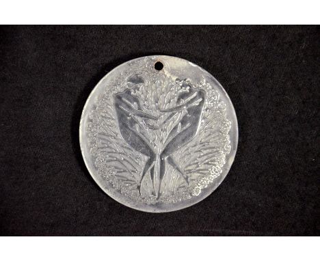 Rene Lalique, a Deux Danseuses glass pendant, designed circa 1919, incised mark R Lalique, 5.5cm diameter