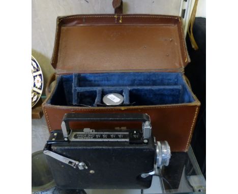 A Kodak magazine cine camera, in case with various lenses.