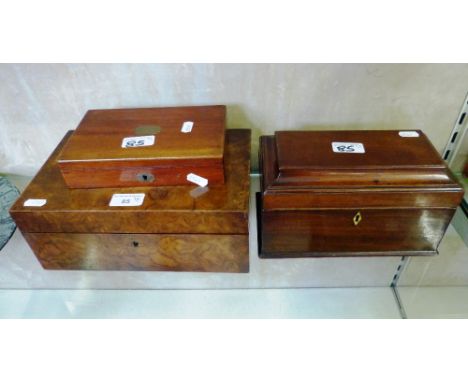 An early 19th century mahogany tea caddy lacking interior, a Victorian burr walnut sewing box and a Victorian mahogany writin