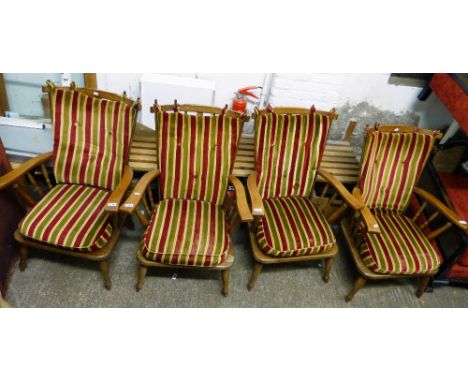 A set of four oak and beech stick-back armchairs