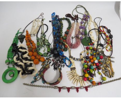 A selection of period and later costume jewellery including a 1930's two tone pink bugle bead necklace of graduated form fast