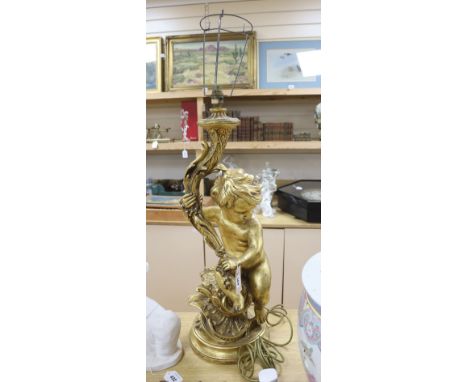 A large moulded gilt putti table lamp, height 70cm excl. light fitting