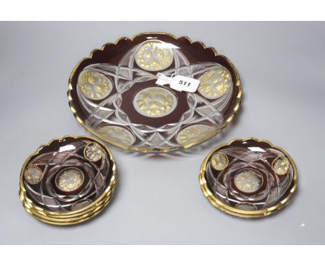 A late 19th century Bohemian intaglio cut and gilded glass dish and six saucers