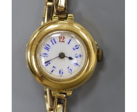 A lady's early 20th century continental 18c yellow metal manual wind wrist watch on gold plated bracelet, gross 22.3 grams, c