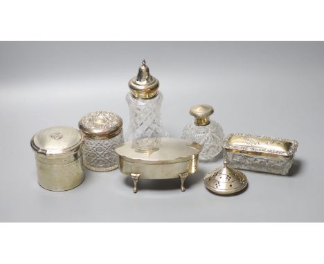A George V silver oval trinket box, 12.5cm, a silver toilet canister and other toilet jars etc.