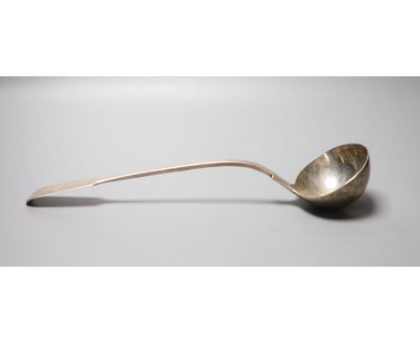 A Victorian silver fiddle pattern soup ladle, with engraved crest, William Smily, London 1862, 34.2cm, 9oz.