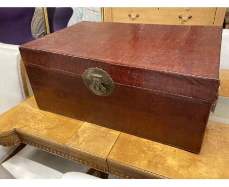 A Chinese leather bound trunk, width 80cm, depth 52cm, height 35cm