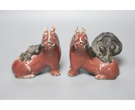 A pair of unusual Chinese copper red glazed 'pig' incense burners/ joss stick holders, late Qing dynasty, height 13cm