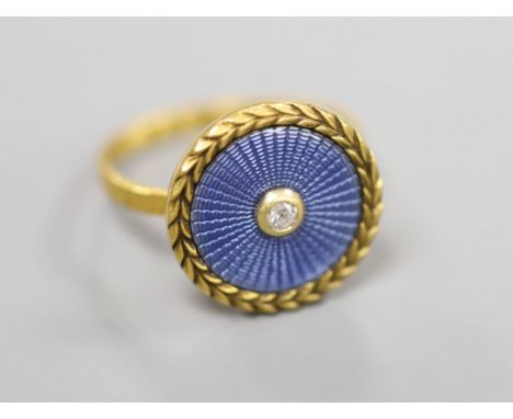 A yellow metal, blue guilloche enamel and diamond set 'button' ring, size K, gross 3.1 grams (adapted), ring head verso stamp