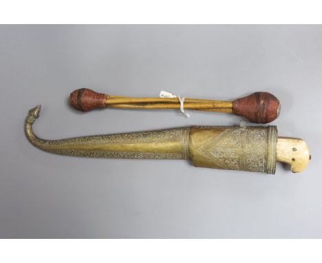 A near Eastern dagger with associated scabbard and a priest or drum stick