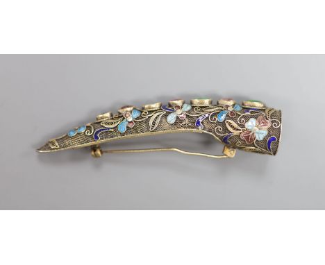 A late 19th/early 20th century Chinese filligree white metal, enamel and gem set nail guard brooch, 85mm.CONDITION: Pin is a 
