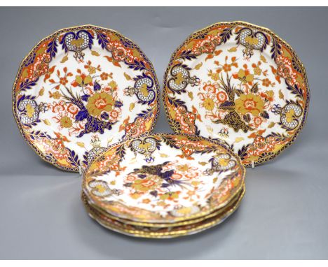 A set of six Royal Crown Derby dessert dishes, decorated in an Imari palette, diameter 23cmCONDITION: One plate chipped at ri