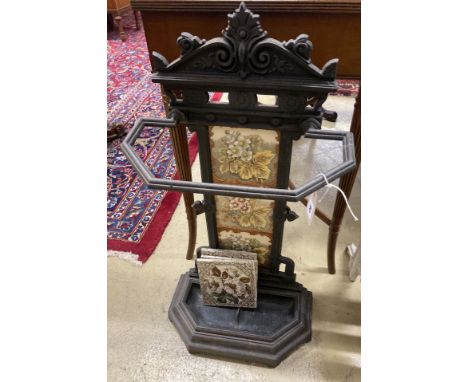 A Victorian style painted cast iron stick stand with tile inset back, width 40cm, depth 21cm, height 78cm