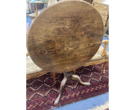 A mid 18th century mahogany tripod table with birdcage platform, diameter 76cm, height 70cm