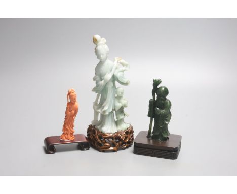 A Chinese coral figure of a lady, 9cm, a Chinese jadeite group of Guanyin with stand 19.5cm and a spinach green jade figure o