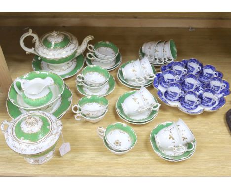 A Copeland blue and white nine cup and saucer cabaret set on stand and a 19th century Rockingham style green and gilt decorat