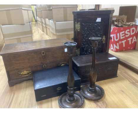 An 18th/19th century oak miniature trunk and miniature corner cupboard, one other miniature oak coffer, pair of candlesticks 