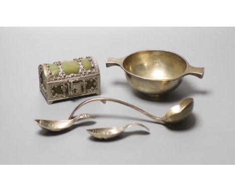 A George V Scottish silver quaich, Edinburgh, 1934, 15.3cm, a plate mounted leatherette casket, two white metal caddy spoons 