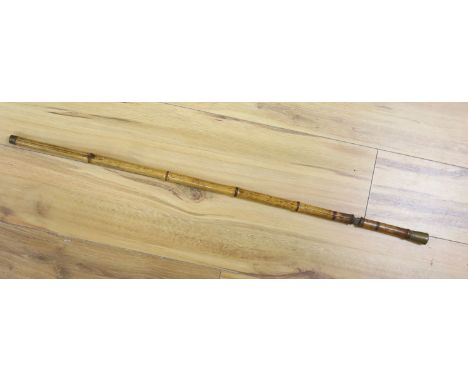A Victorian bamboo cased swordstick, the blade stamped Solingen, 89cm long