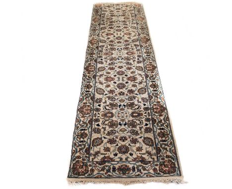AN INDIAN PERSIAN DESIGN RUNNER with a light blue-grey pattern. 363cm by 76cm