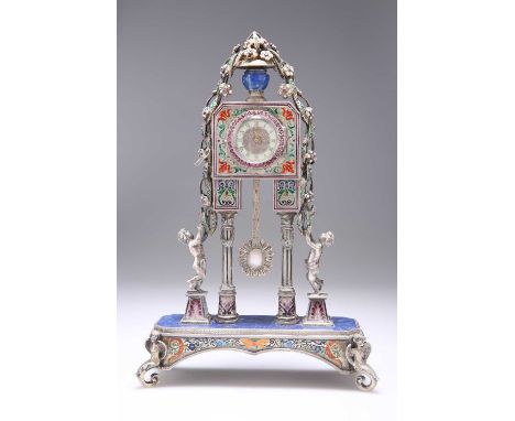 A FINE VIENNESE ENAMEL, LAPIS, SILVER AND GEM-SET MANTEL CLOCK, CIRCA 1880 in the form of a lapis vase of cascading gem-set f