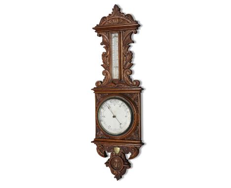 A LARGE EDWARDIAN OAK BAROMETER carved with scrolls and leaves, with a brass presentation plaque dated 1901. 100cm high