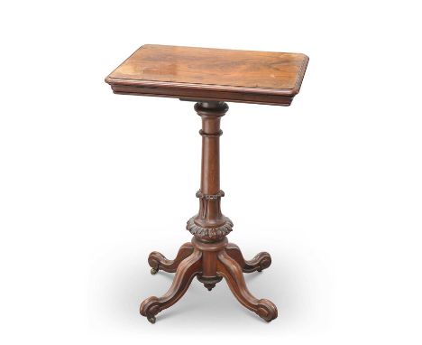 A 19TH CENTURY ROSEWOOD READING TABLE the hinged adjustable easel top rising and falling on a columnar leaf-collared stem con