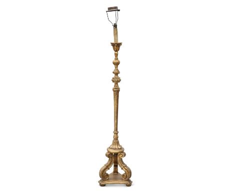 A 19TH CENTURY GILTWOOD STANDARD LAMP the fluted columnar stem raised on three scroll-form supports issuing from a tri-form b