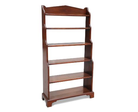 A 19TH CENTURY MAHOGANY WATERFALL BOOKCASE the five shelves with reeded fronts between shaped sides with reeded edges, raised