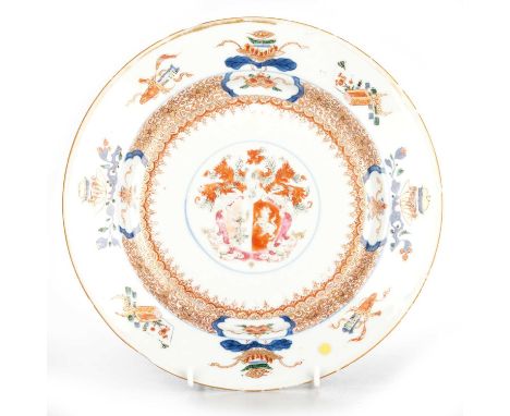 A CHINESE ARMORIAL PORCELAIN DISH, YONGZHENG, CIRCA 1723  circular, painted in an Imari palette with objects around the rim, 