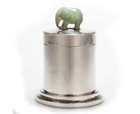 A STERLING SILVER AND JADE CADDY cylindrical with a pull-off cover, the lid surmounted by the carved jade figure of an elepha