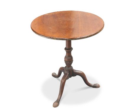 A GEORGE III MAHOGANY TILT-TOP TRIPOD TABLE the circular top raised on a turned stem continuing to downswept legs terminating