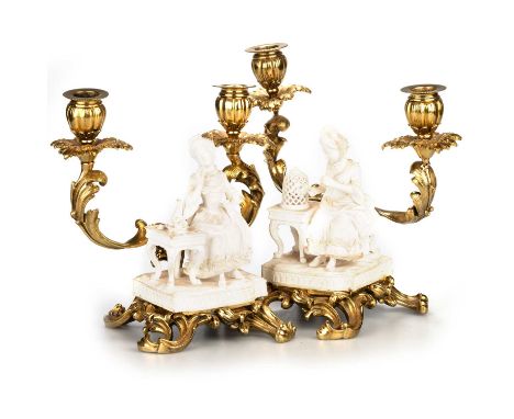 A PAIR OF ORMOLU-MOUNTED MINTON BISCUIT PORCELAIN FIGURES, FROM THE FIVE SENSES, CIRCA 1830 of Taste and Touch, each modelled