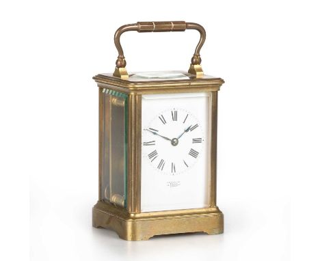 A FRENCH BRASS CARRIAGE CLOCK, CIRCA 1900 the enamel dial inscribed EXAMINED BY DENT 34 COCKSPUR ST LONDON, backplate numbere