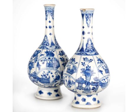 TWO CHINESE BLUE AND WHITE PORCELAIN BOTTLE VASES, KANGXI PERIOD each vase of pear-form and raised on a tall, spreading foot.