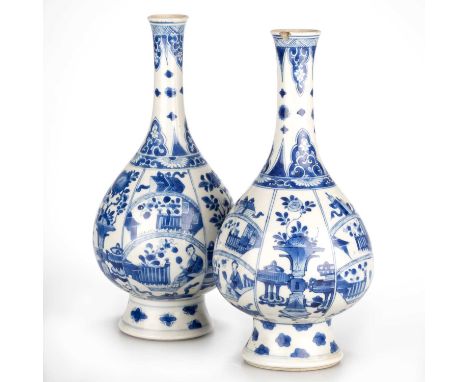 TWO CHINESE BLUE AND WHITE PORCELAIN BOTTLE VASES, KANGXI PERIOD each vase of pear-form and raised on a tall, spreading foot.