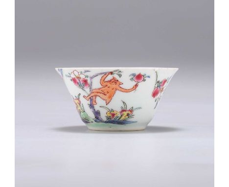 AN 18TH CENTURY CHINESE PORCELAIN TEA BOWL enamel painted in the Famille Rose palette with deer, a monkey in a tree, rockwork